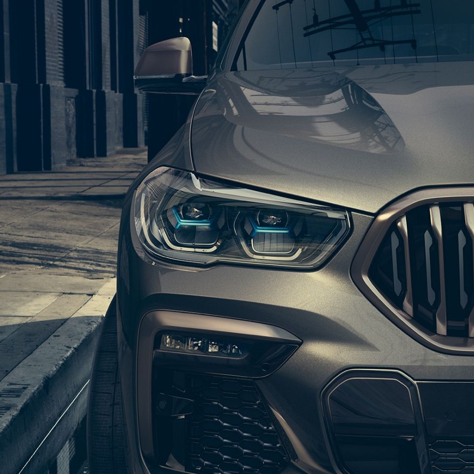 BMW Laserlight. Zbliżenie na BMW X6 z widokiem reflektorów Laserlight.