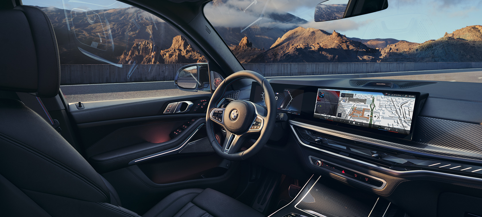 BMW X7 M60i xDrive G07 LCI kokpit wnętrze BMW X7 M60i xDrive G07 LCI kokpit wnętrze na tle górskiego krajobrazu
