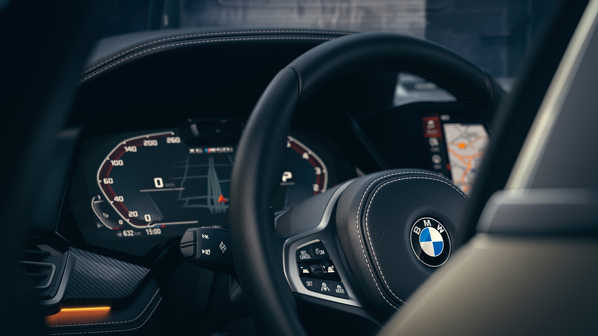 Systemy wspomagające kierowcę BMW. Zbliżenie wnętrza BMW z widokiem zestawu wskaźników.